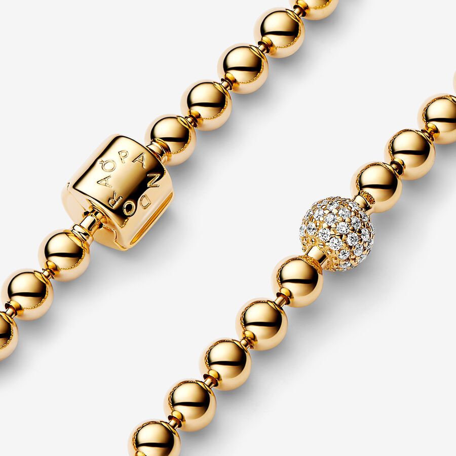 Pandora logo 14k gold-plated bracelet with clear c