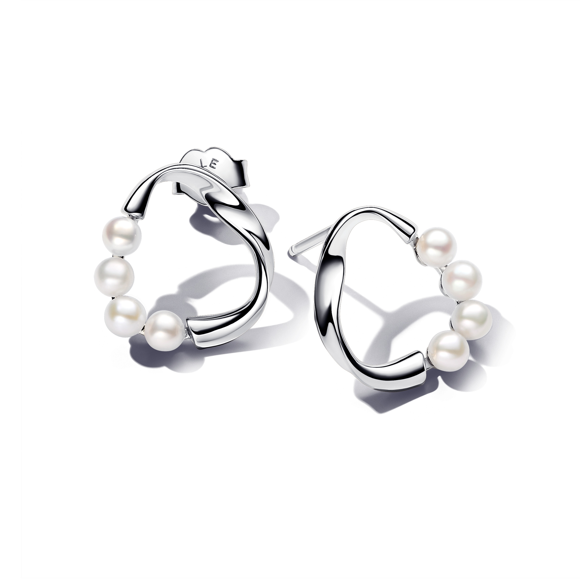 Sterling silver stud earrings with white treated f