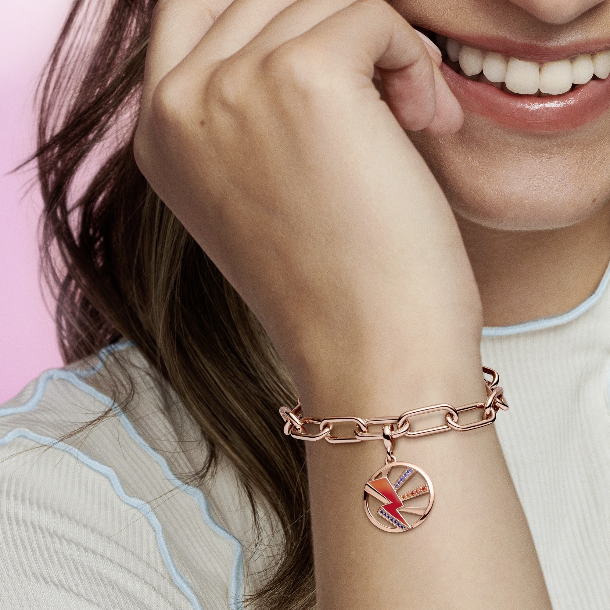 crystal, red and yellowenamelThunder 14k rose gold-plated medallionwith stellar blue crystal,dark