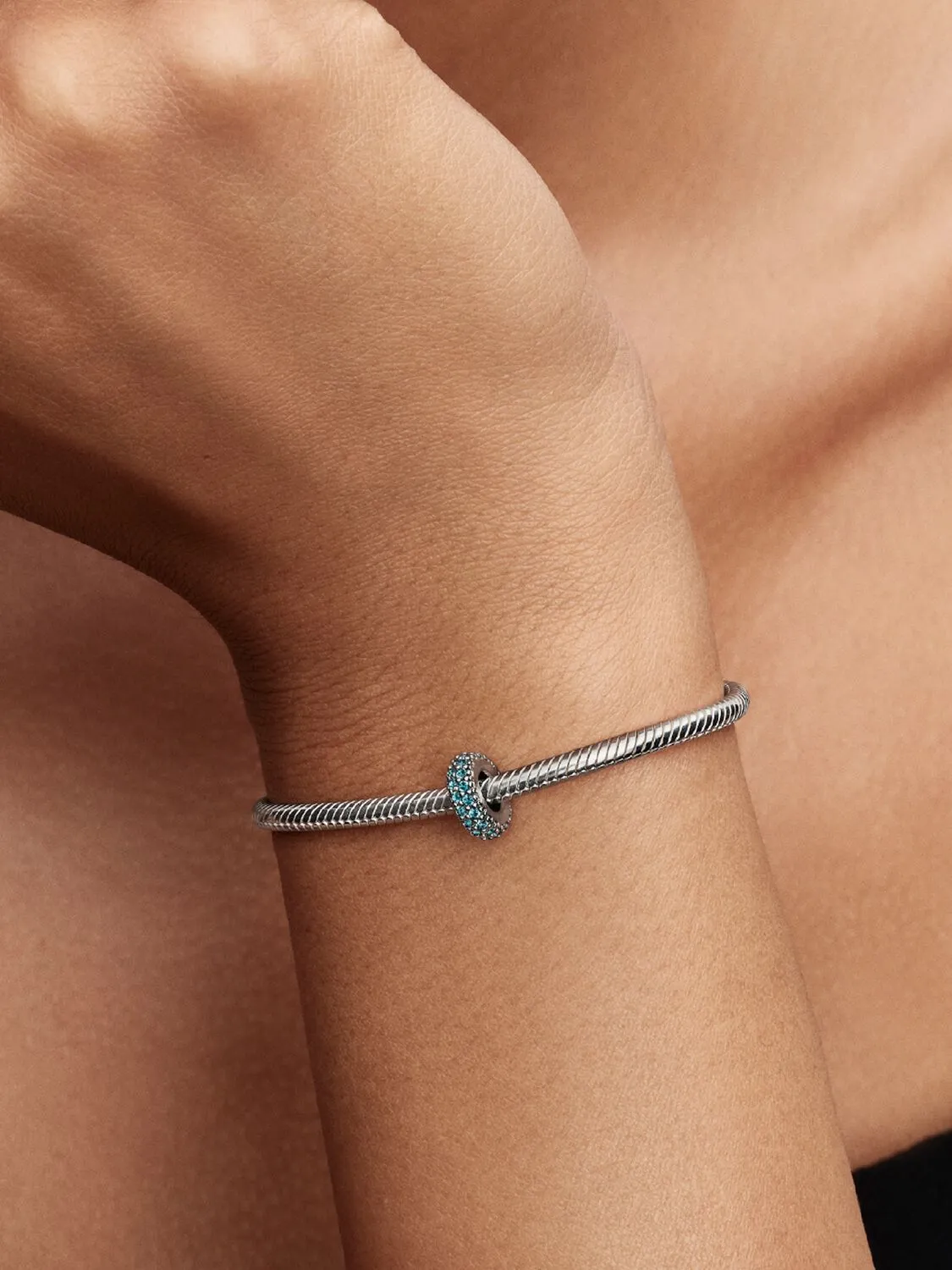 Abstract sterling silver spacer with icy blue crys