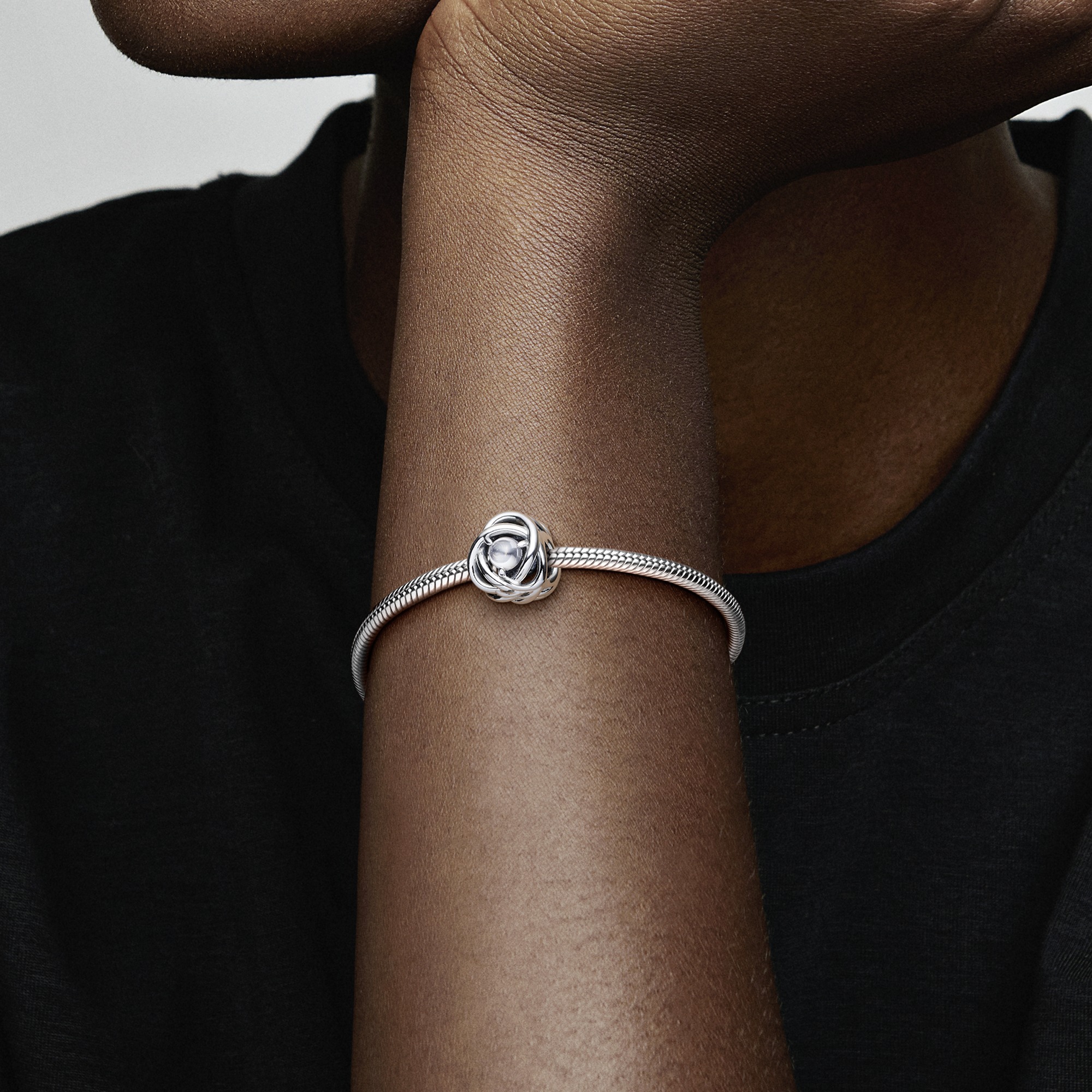 Sterling silver charm with clear cubic zirconia