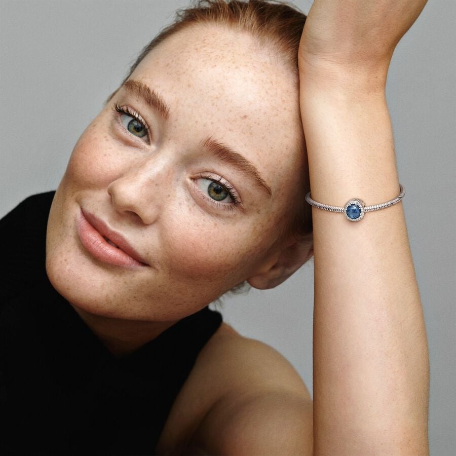 Abstract silver charm with moonlight blue crystal 