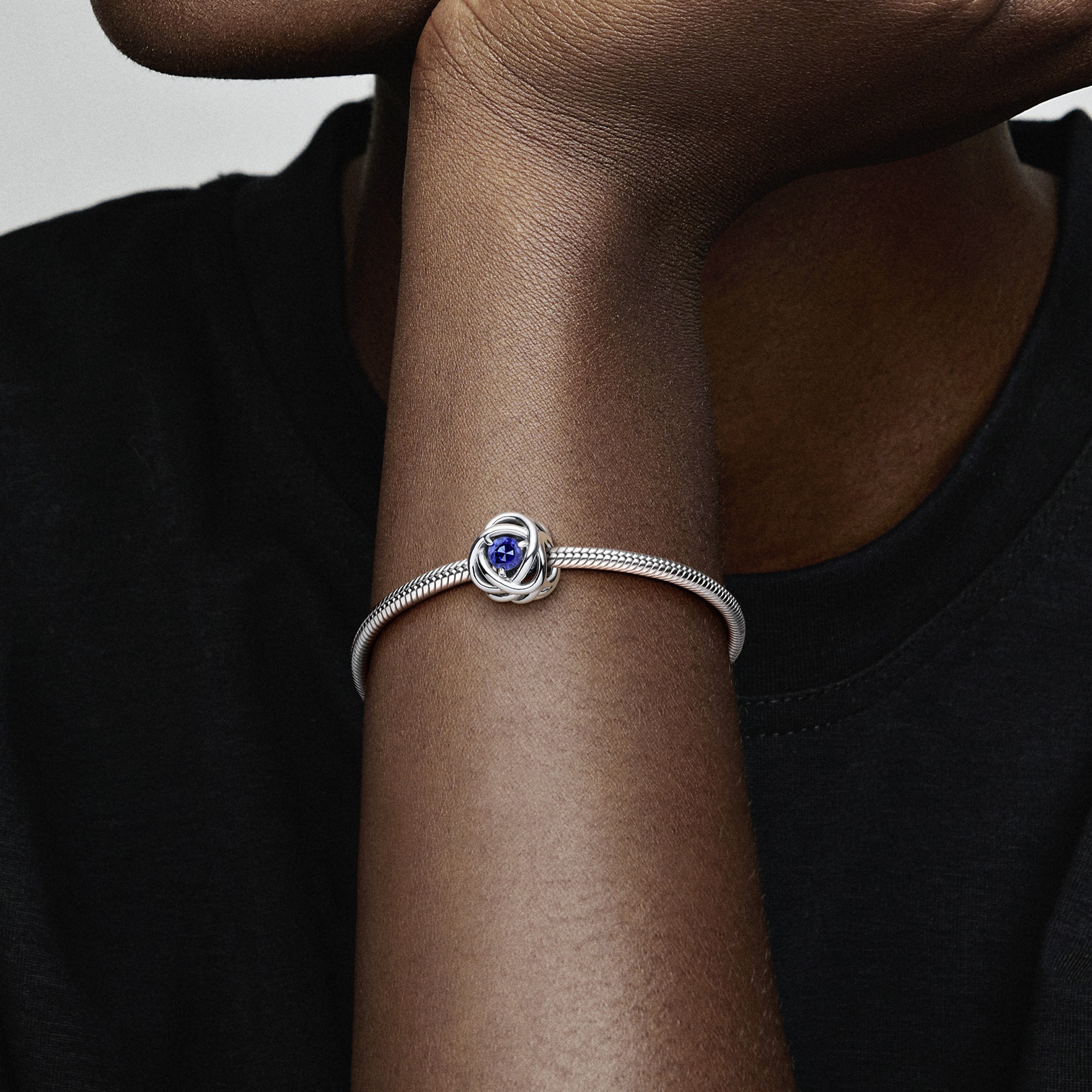 Sterling silver charm with princess blue crystal