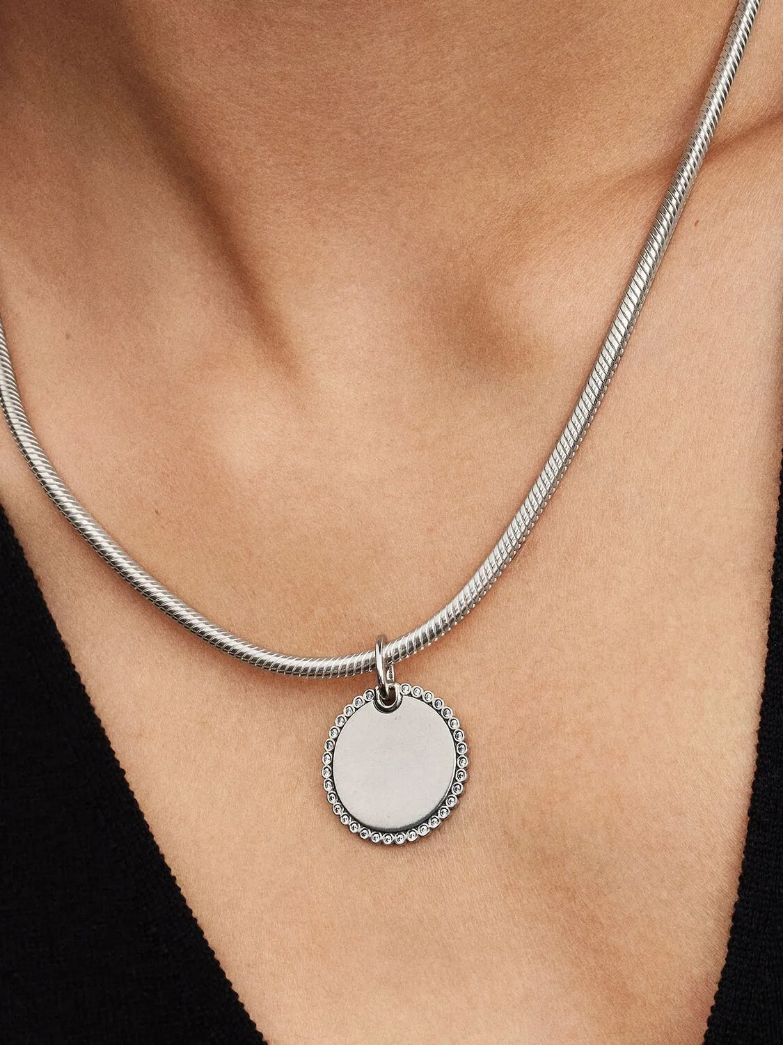 Engravable round sterling silver pendant with clea