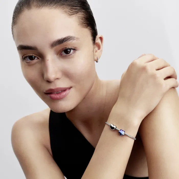 Puffy star sterling silver charm with blue enamel