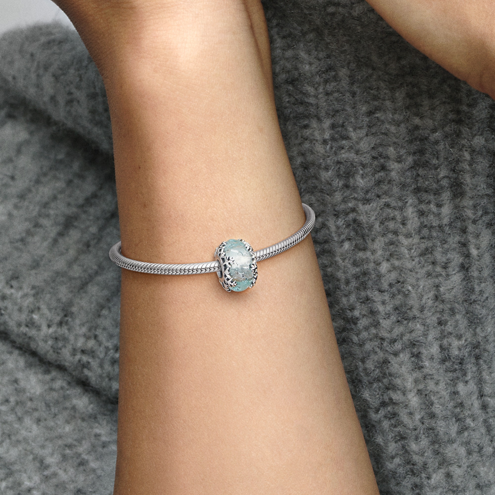 Snowflake sterling silver charm with blue frozen M