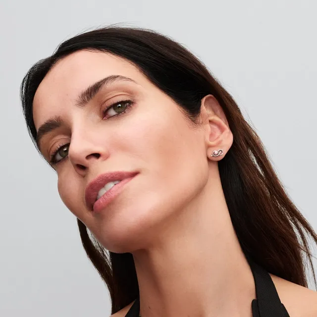 Infinity knot sterling silver stud earrings with pink lacquered artificial pearl and clear cubic zirconia/ 293761C01