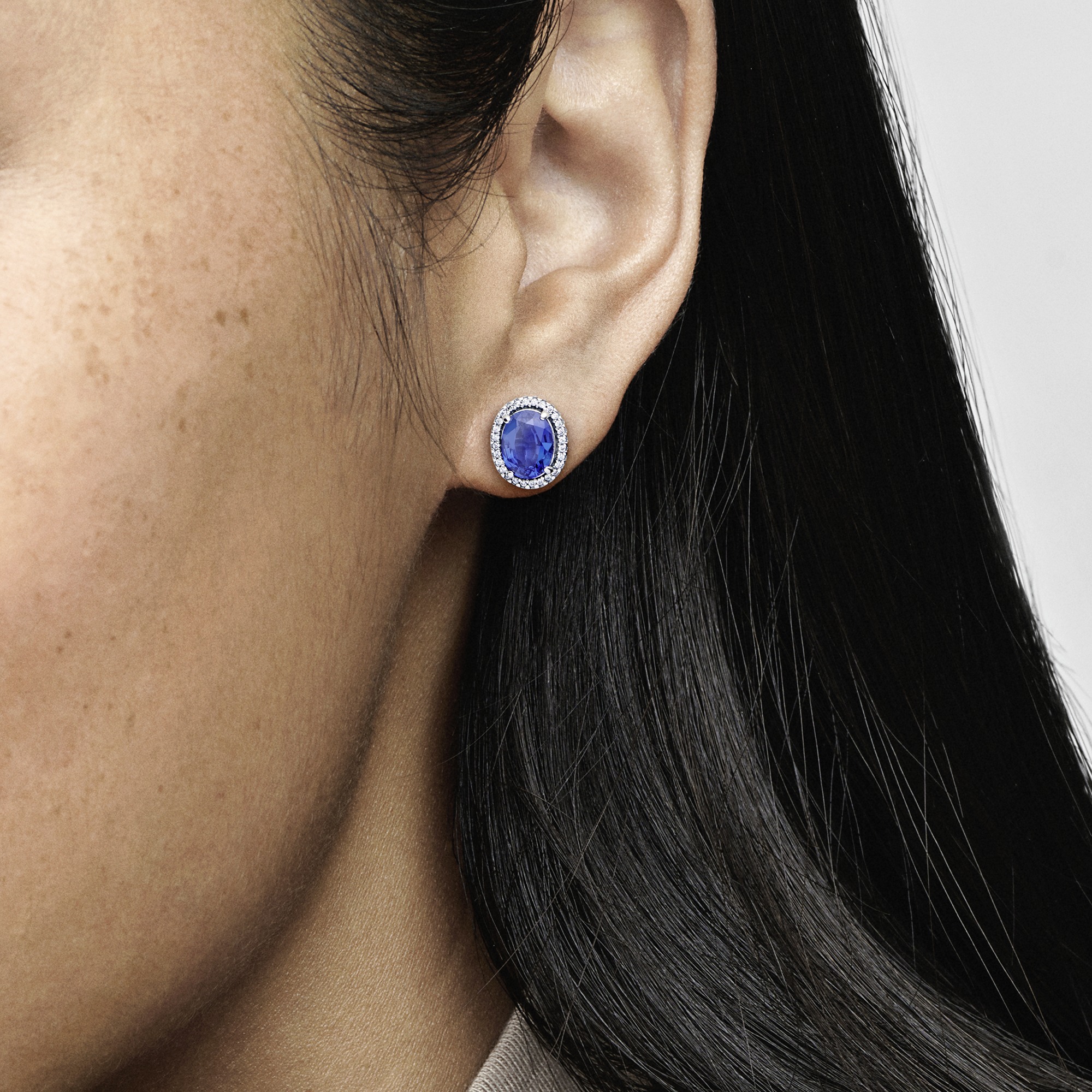 Sterling silver stud earrings with princess blue crystal and clear cubic zirconia /290040C01