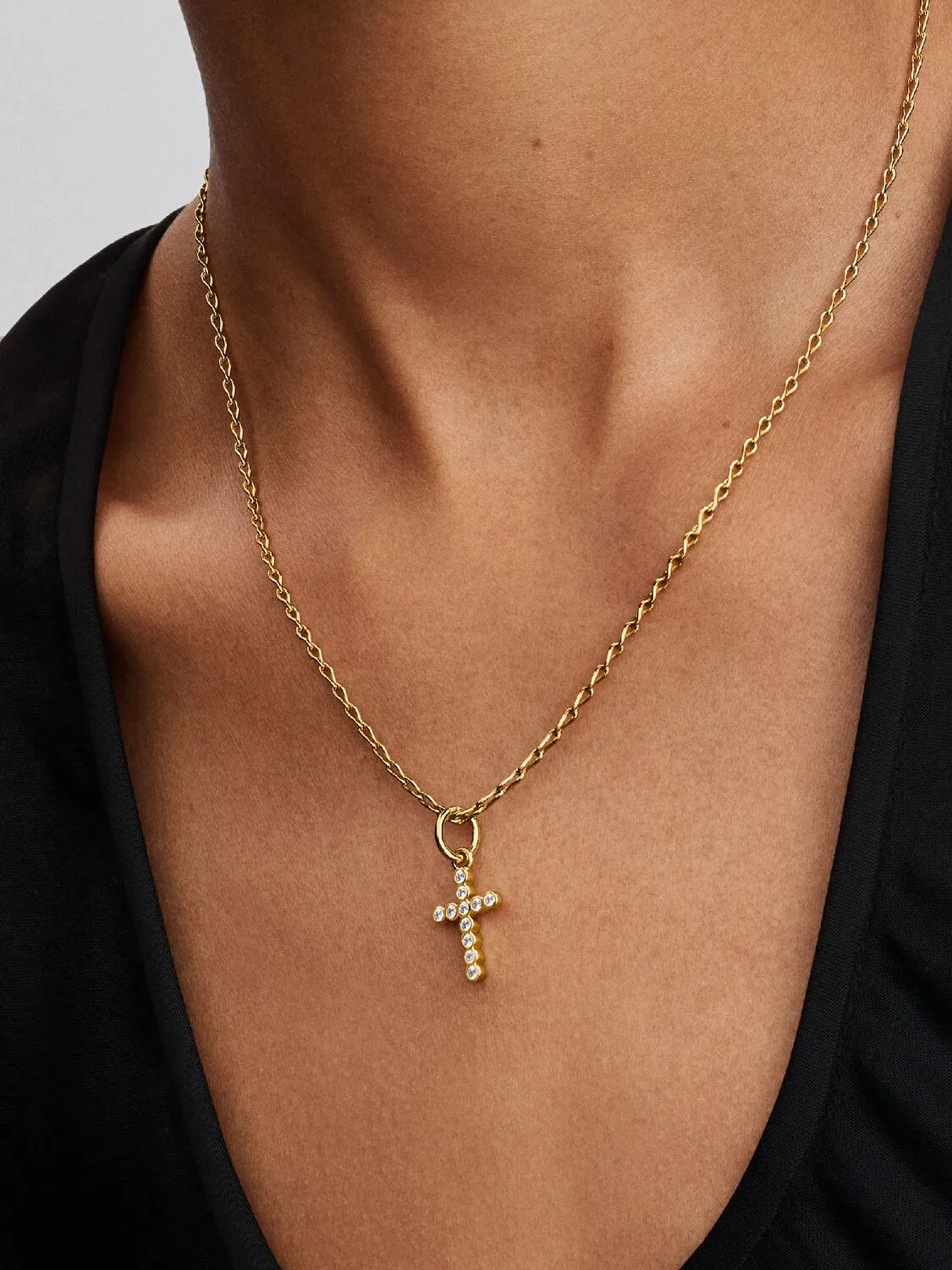 Cross 14k gold-plated dangle with clear cubic zirc