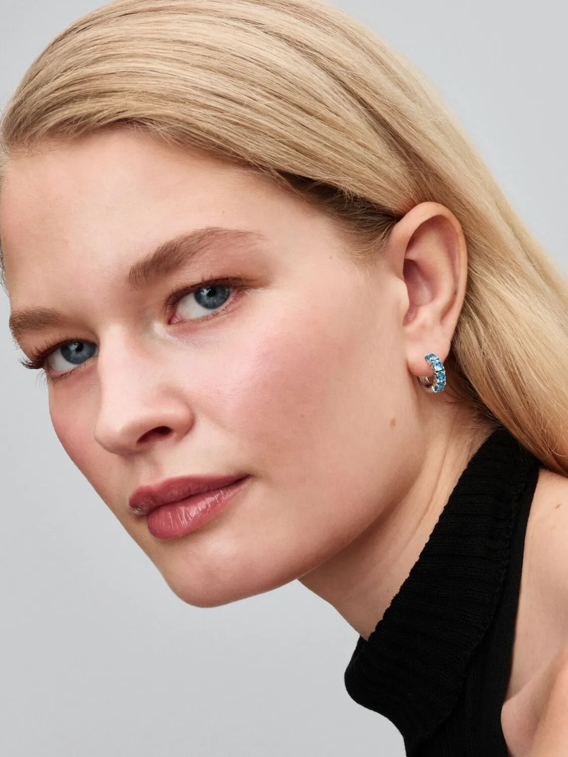 Sterling silver hoop earrings with aquamarine blue