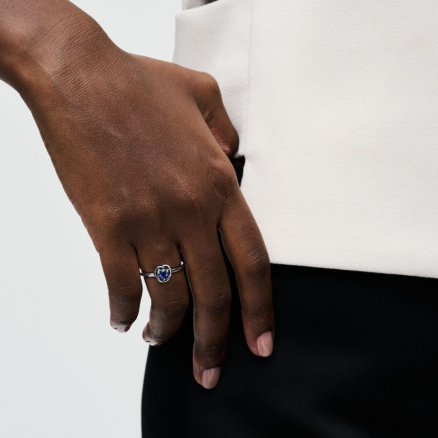 Sterling silver ring with princess blue crystal