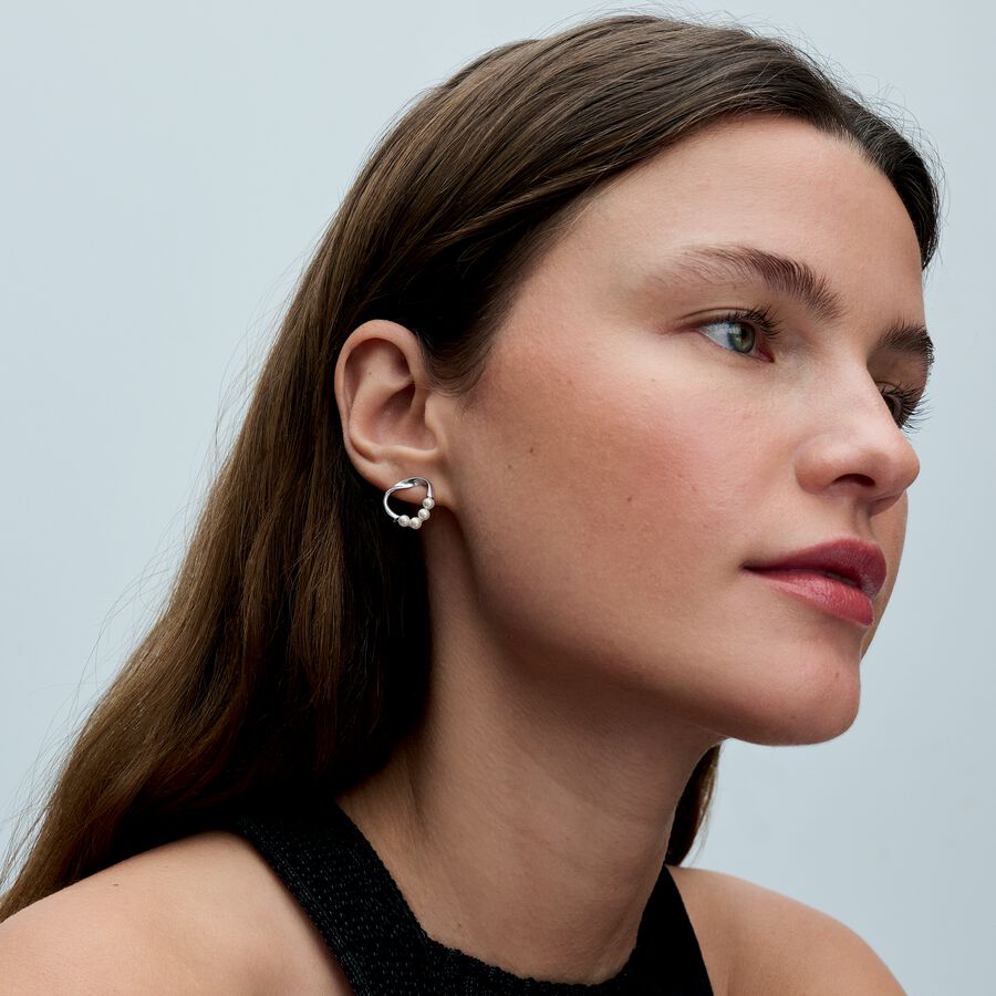 Sterling silver stud earrings with white treated f