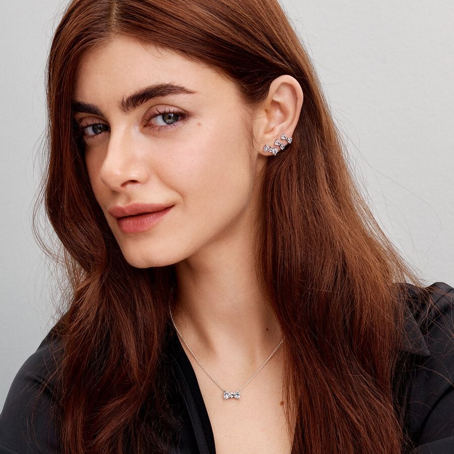 Bow sterling silver stud earrings with clear cubic