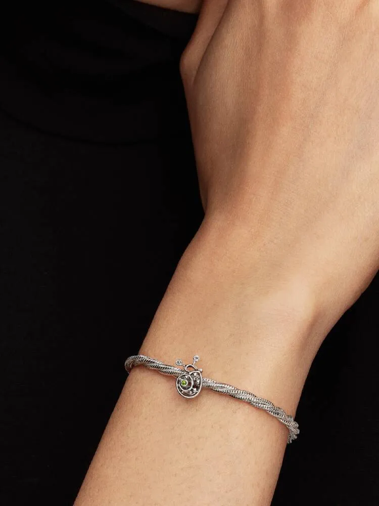 Snail sterling silver charm with light green cryst